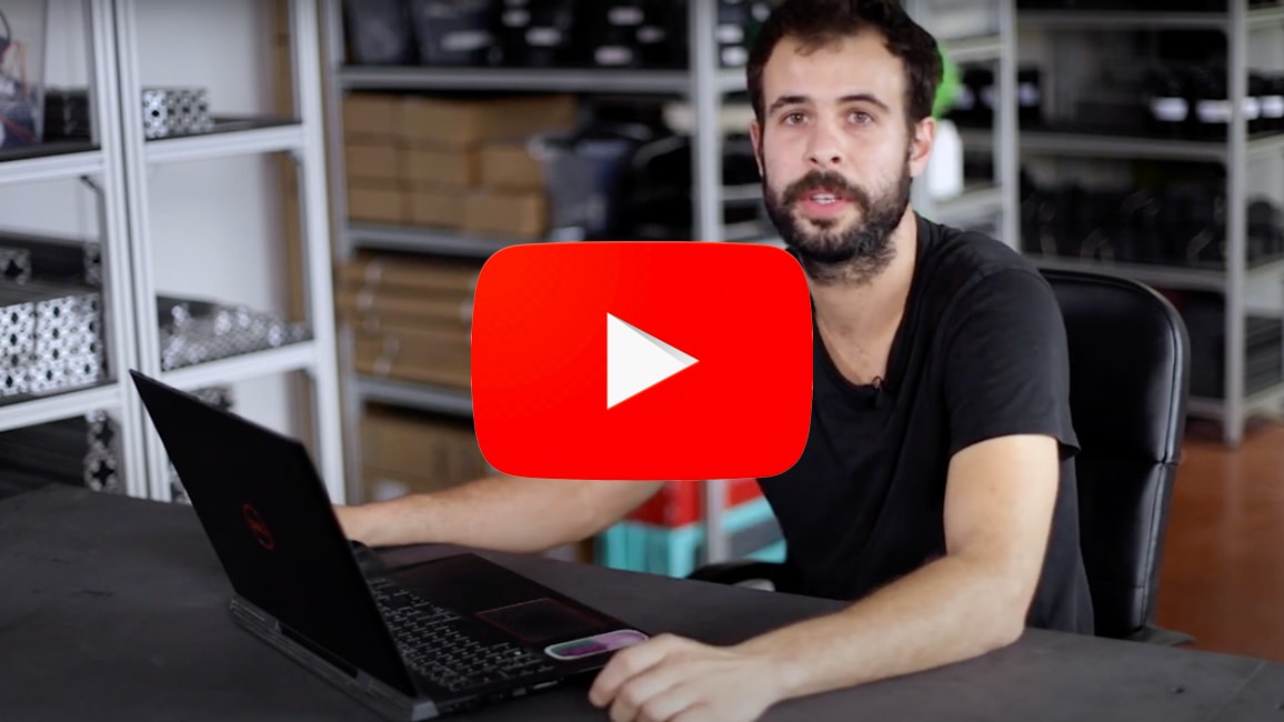 Martin at his computer to transform his drawing into a 3d file
