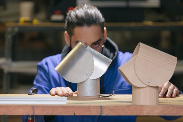 Hippolite checking his lamp prototypes