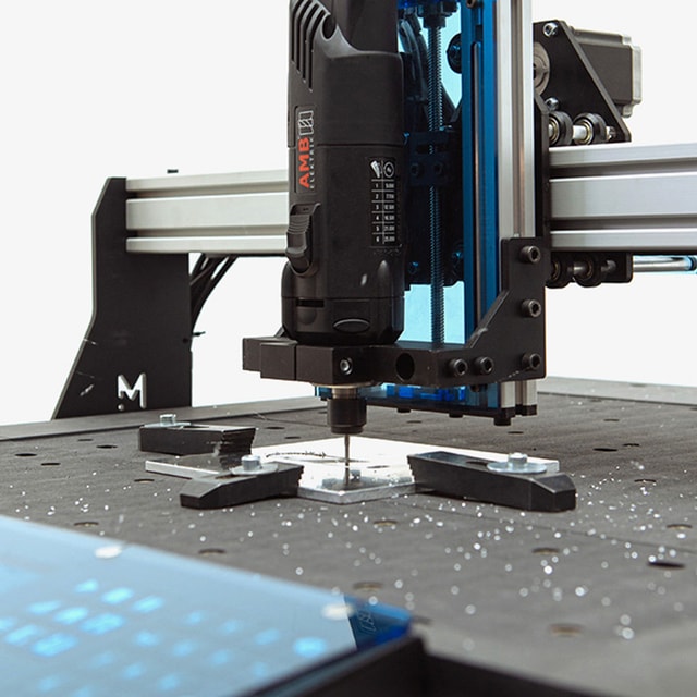 Mekanika Evo CNC milling machine close up while milling some aluminium