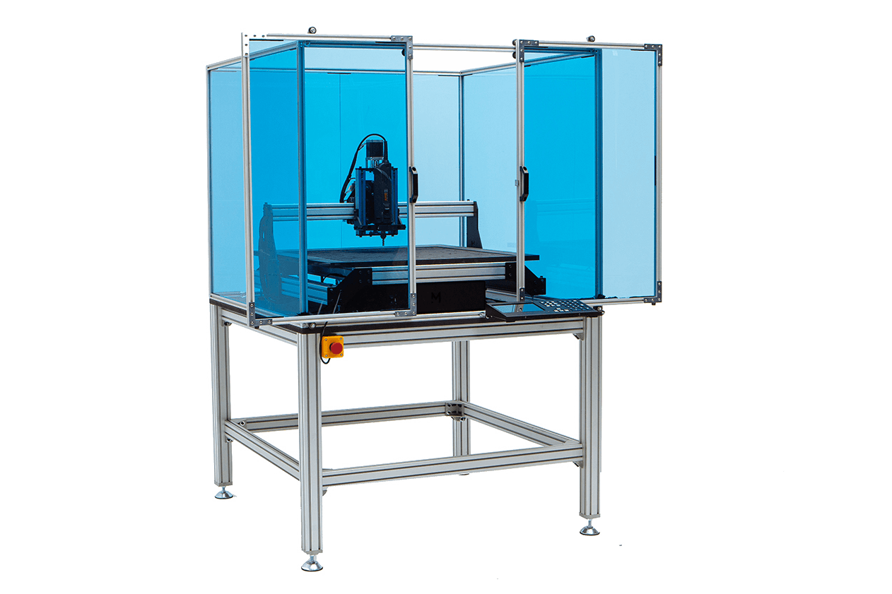 The Mekanika Evo Bundle education composed of a worktable, an safety enclosure and a Evo milling machine on a grey background