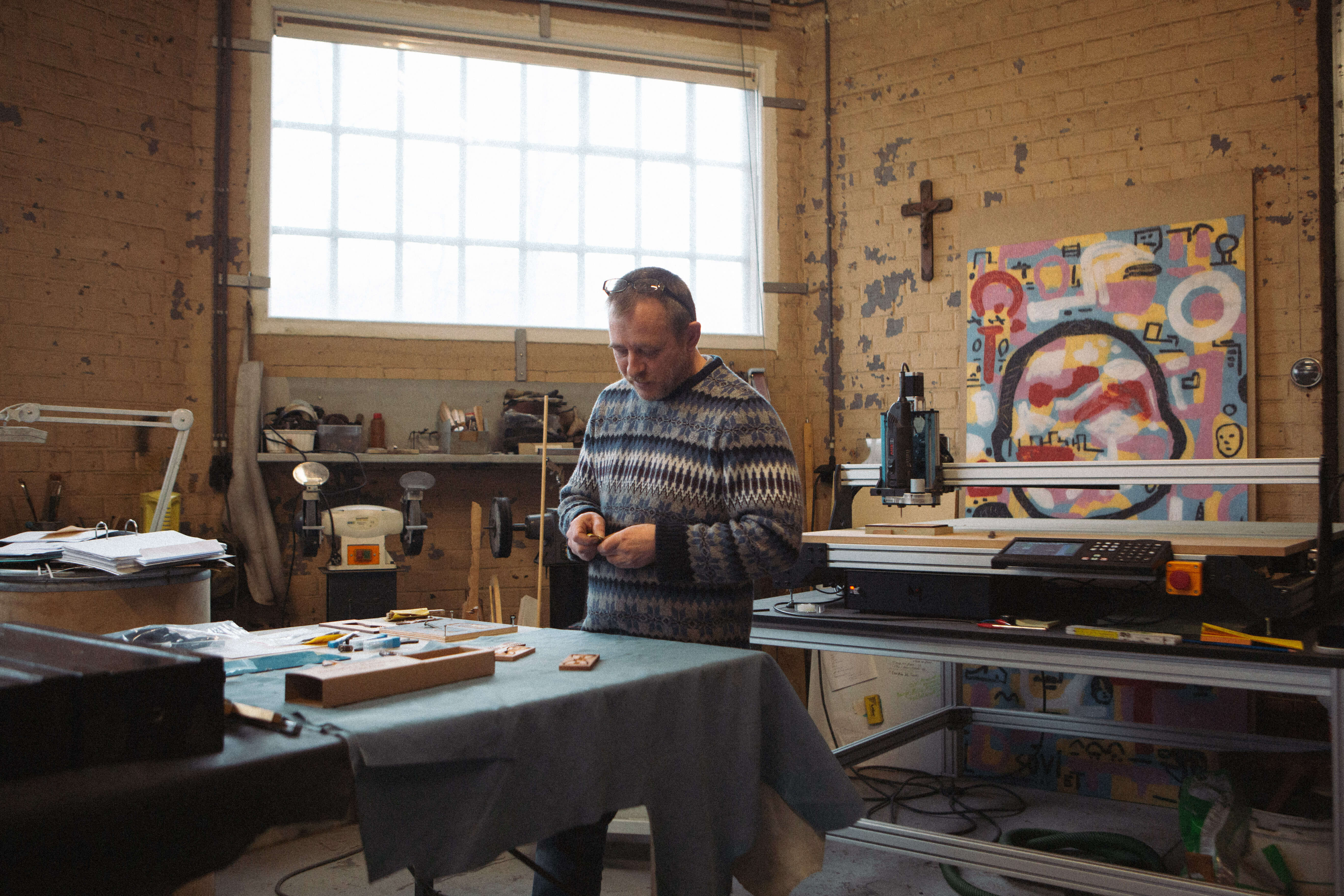 Michel from MF Belgium standing in his workshop next to his Mekanika CNC machine