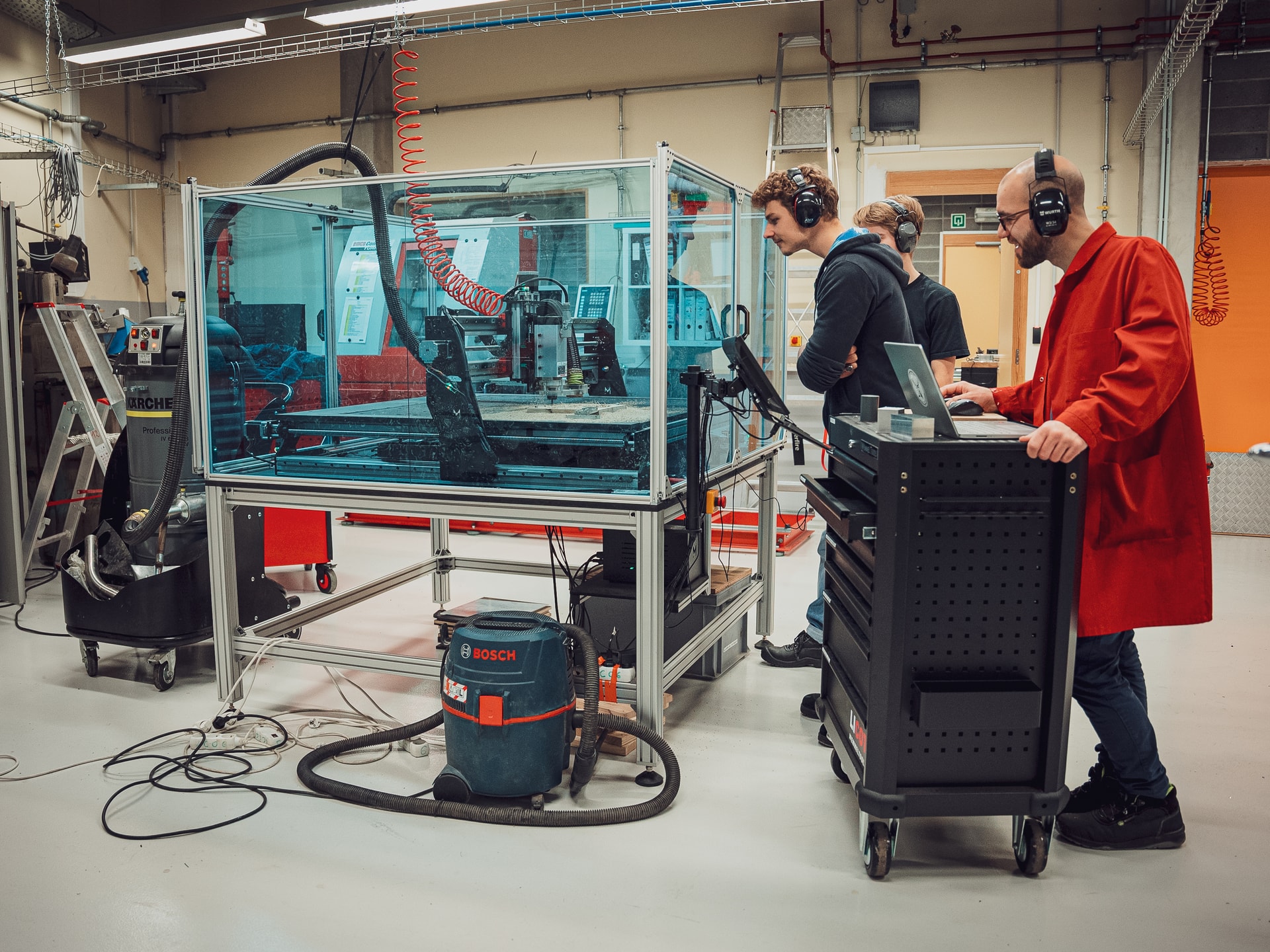 Students and Teachers at ECAM University Brussels using a Mekanika CNC Pro milling machine in a security enclosure