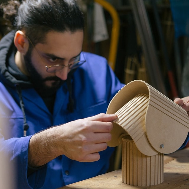 Hyppolite fro Duplex Studio checking his lamp prototype