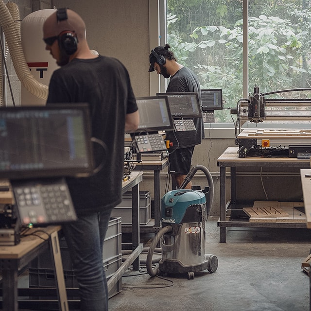 Duplex studio workshop with Clément and Hippolite working on two different Pro CNC milling machine