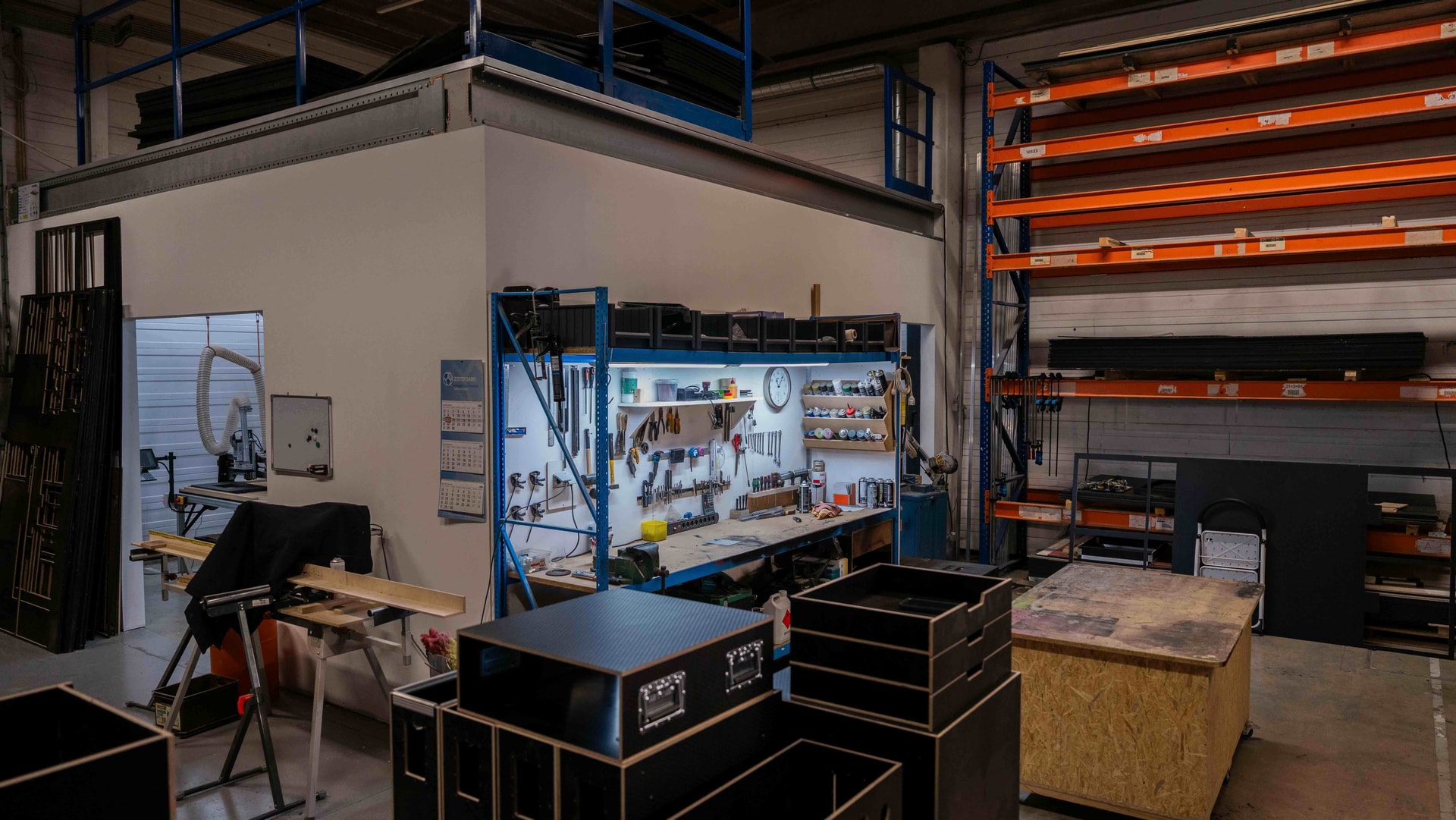 WeCase workshop, with the various material and assembly areas. On the left, the Fab