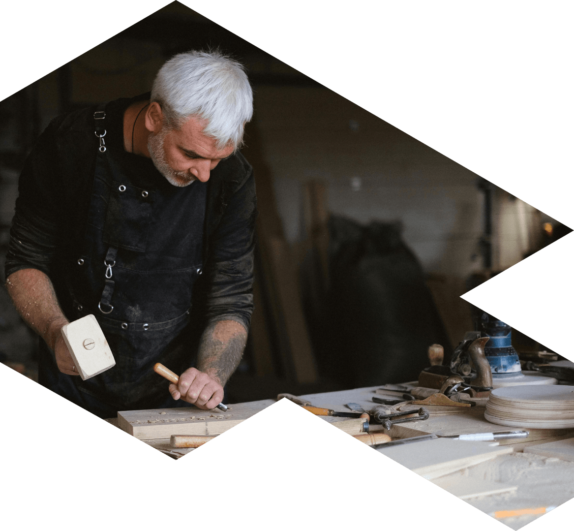 Craftsperson sculpting wood