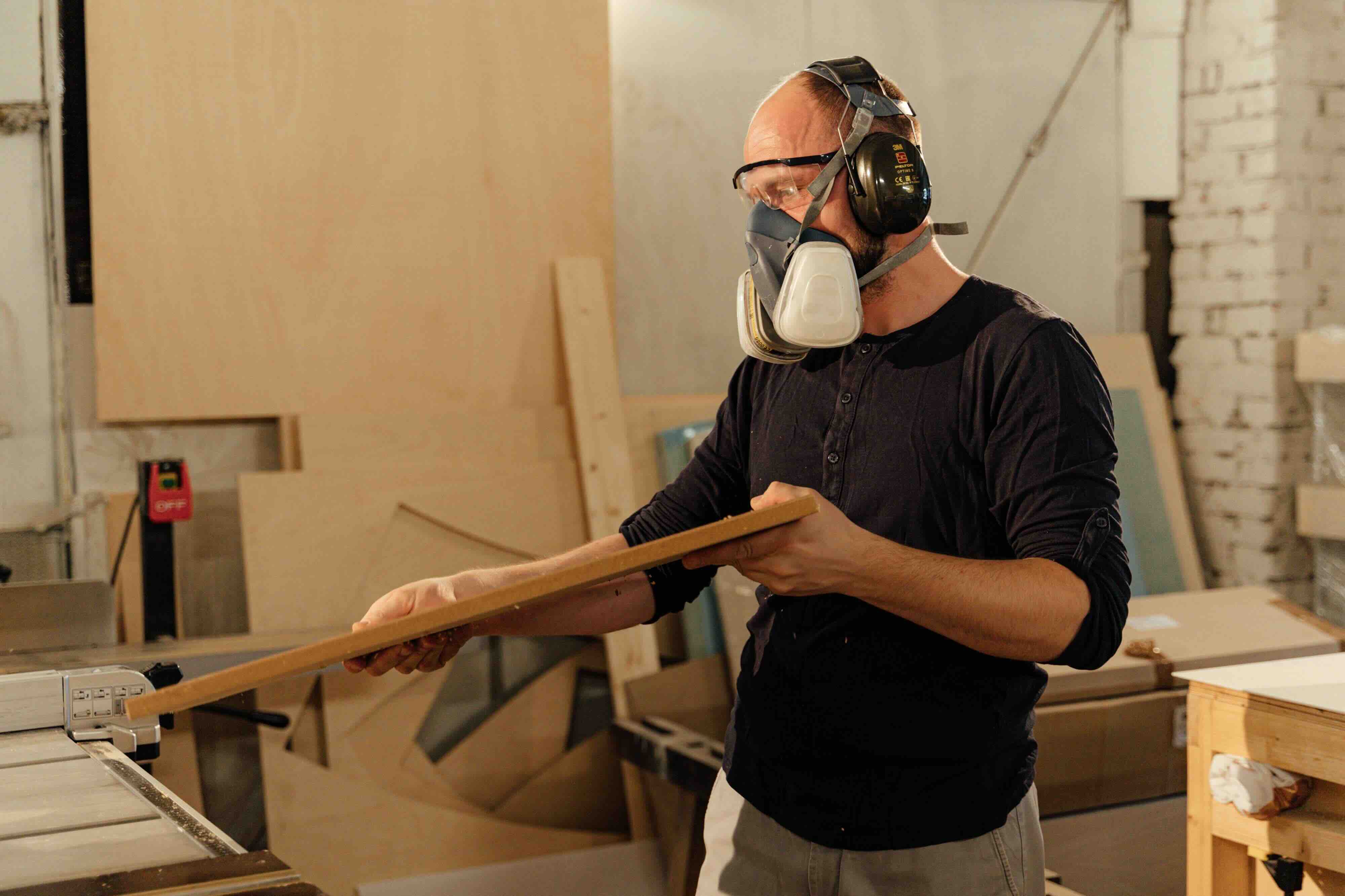 Manufacturer holding a wood panel