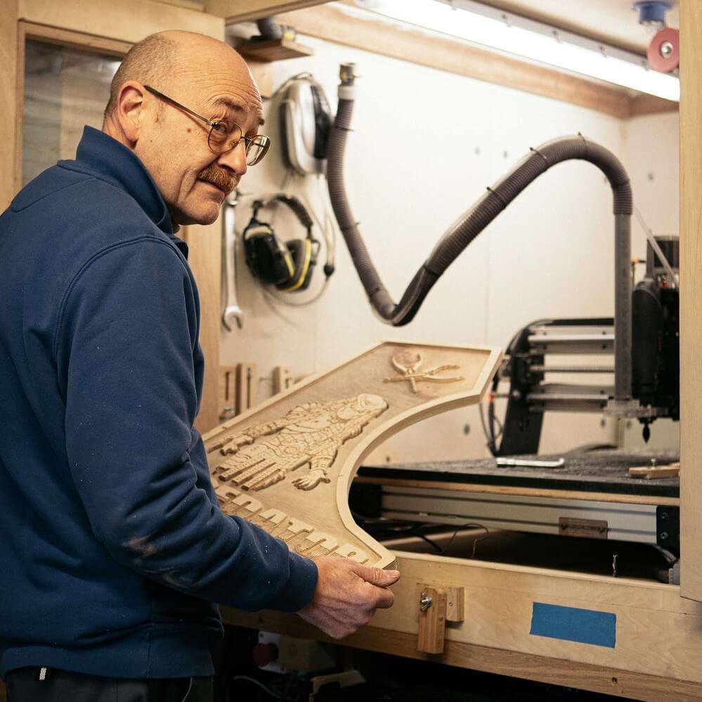 Craftsman using a CNC milling machine