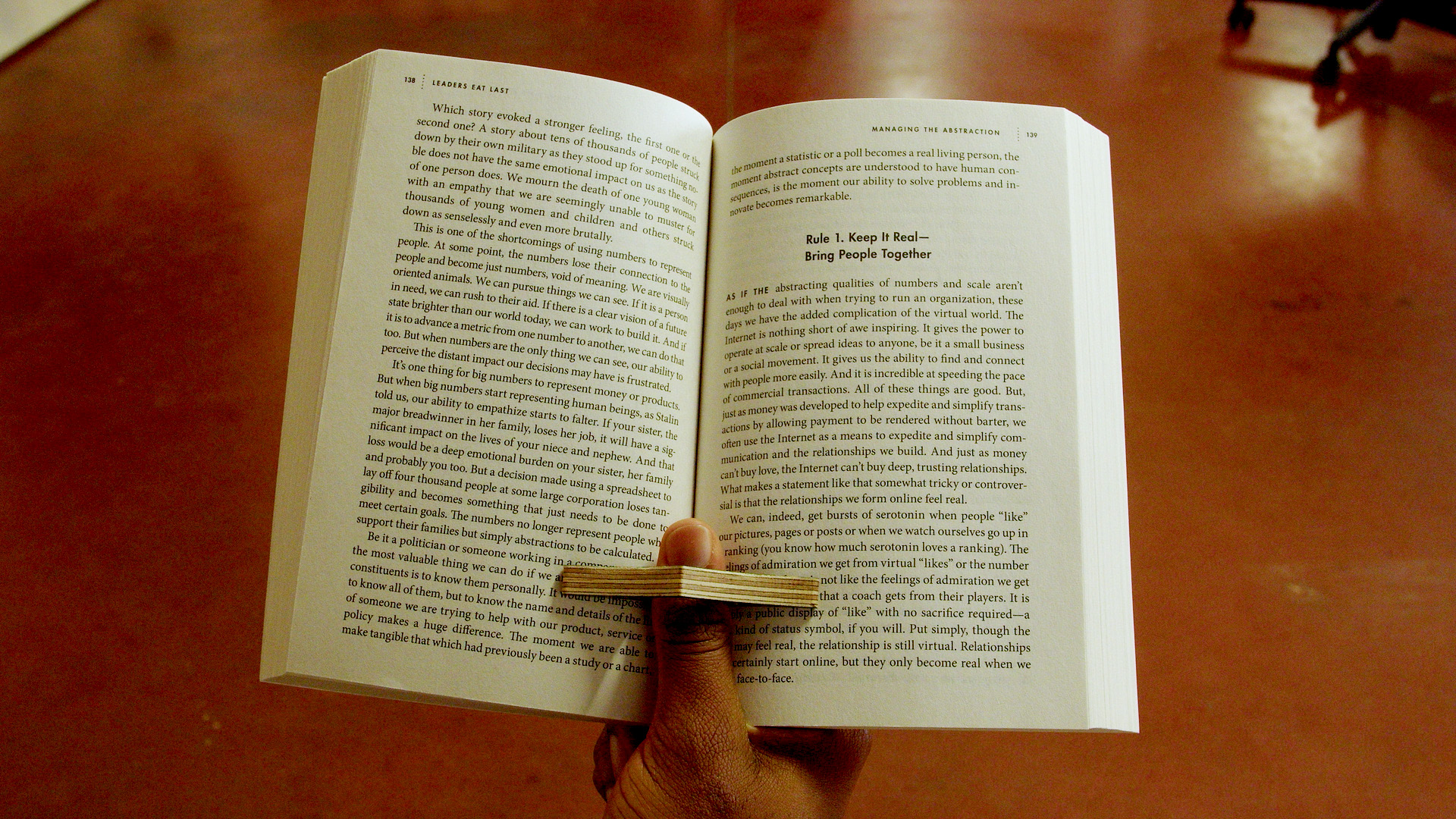 An example of the CNC milled page holder being used in a book